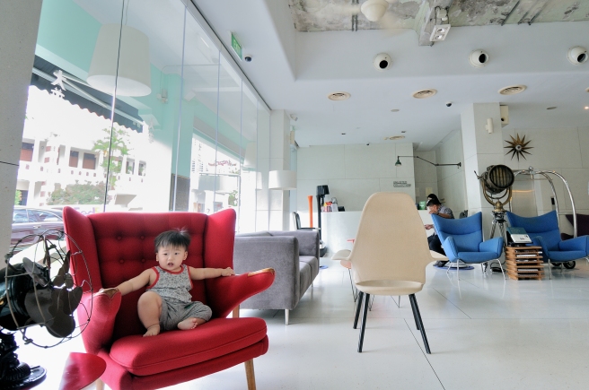 Baby Noah blending in the strong design of New Majestic lobby with his #thuglife pose.