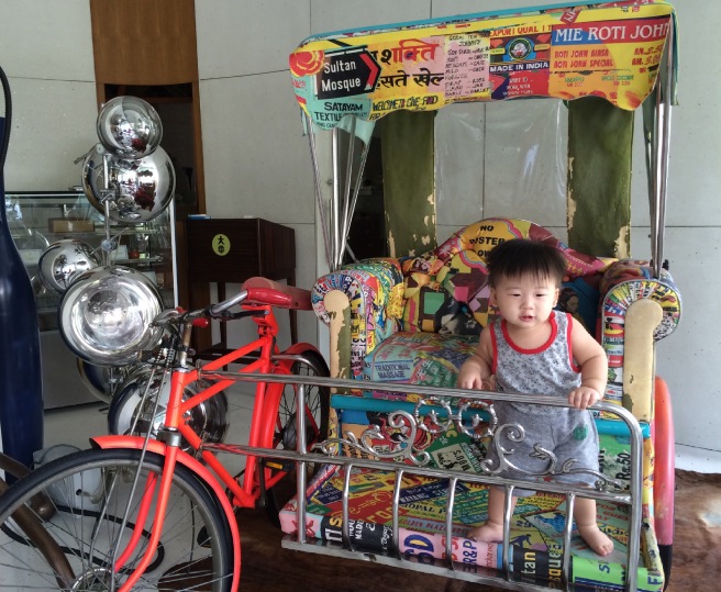 Baby Noah hopping on for a ride on the trishaw! || image credit: Lifeafternoah.wordpress